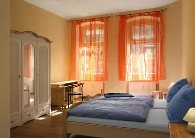 Ein Bett oder Betten in einem Zimmer der Unterkunft City Quartier
