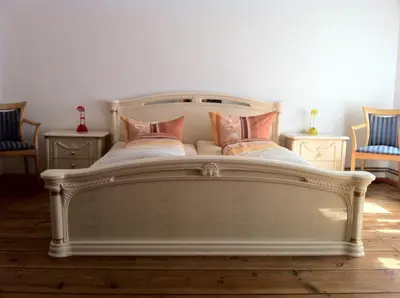 Ein Bett oder Betten in einem Zimmer der Unterkunft City Quartier
