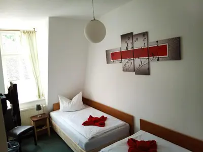 Ein Bett oder Betten in einem Zimmer der Unterkunft Altstadtpension Brandenburg
