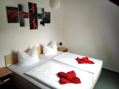 Ein Bett oder Betten in einem Zimmer der Unterkunft Altstadtpension Brandenburg