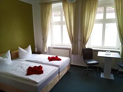 Ein Bett oder Betten in einem Zimmer der Unterkunft Altstadtpension Brandenburg