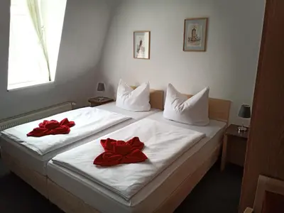 Ein Bett oder Betten in einem Zimmer der Unterkunft Altstadtpension Brandenburg