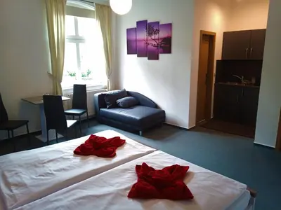 Ein Bett oder Betten in einem Zimmer der Unterkunft Altstadtpension Brandenburg