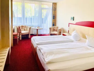 Ein Bett oder Betten in einem Zimmer der Unterkunft Morada Hotel Am Mellensee