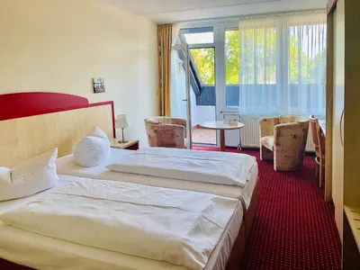Ein Bett oder Betten in einem Zimmer der Unterkunft Morada Hotel Am Mellensee