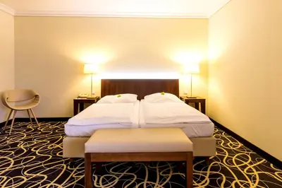 Ein Bett oder Betten in einem Zimmer der Unterkunft relexa hotel Stuttgarter Hof