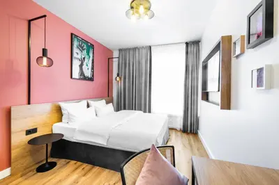 Ein Bett oder Betten in einem Zimmer der Unterkunft CALMA Berlin Mitte