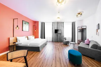 Ein Bett oder Betten in einem Zimmer der Unterkunft CALMA Berlin Mitte