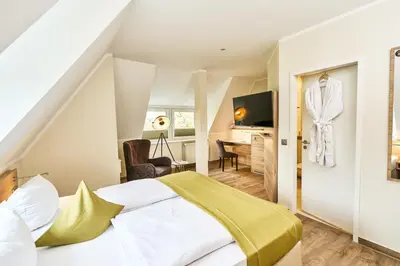 Ein Bett oder Betten in einem Zimmer der Unterkunft Lounge-Hotel Seeterrassen