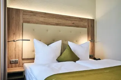 Ein Bett oder Betten in einem Zimmer der Unterkunft Lounge-Hotel Seeterrassen
