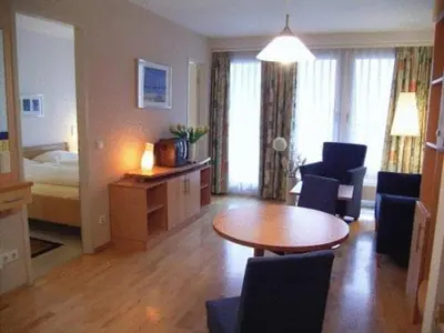 Ein Bett oder Betten in einem Zimmer der Unterkunft TopDomizil Apartments Checkpoint Plaza