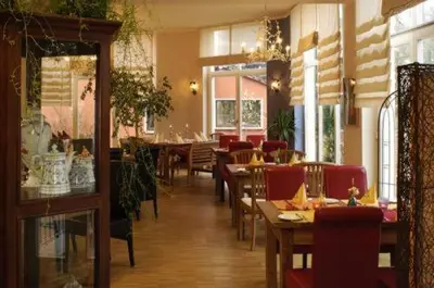 Ein Sitzbereich in der Unterkunft Arthotel Landhaus Zur Alten Gärtnerei
