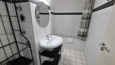 Ein Badezimmer in der Unterkunft TopDomizil - Apartments 