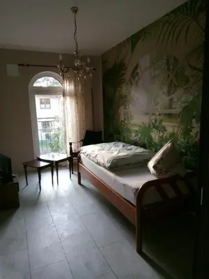 Ein Bett oder Betten in einem Zimmer der Unterkunft Bali Suite
