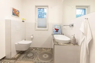 Ein Badezimmer in der Unterkunft Seeparkvilla