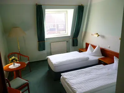 Ein Bett oder Betten in einem Zimmer der Unterkunft Hotel Brandenburg