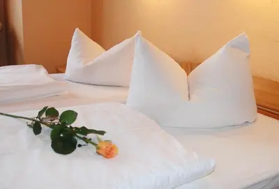 Ein Bett oder Betten in einem Zimmer der Unterkunft Hotel am Hermannplatz