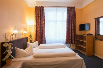 Ein Bett oder Betten in einem Zimmer der Unterkunft Hotel am Hermannplatz