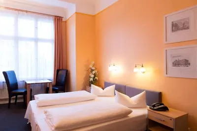 Ein Bett oder Betten in einem Zimmer der Unterkunft Hotel am Hermannplatz