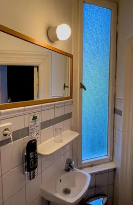 Ein Badezimmer in der Unterkunft Hotel-Maison Am Olivaer Platz