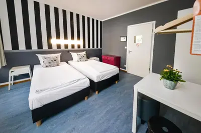 Ein Bett oder Betten in einem Zimmer der Unterkunft Old Town Hostel