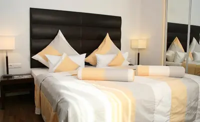 Ein Bett oder Betten in einem Zimmer der Unterkunft Resort Mark Brandenburg & Fontane Therme