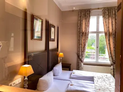 Ein Bett oder Betten in einem Zimmer der Unterkunft Hotel Kronprinz