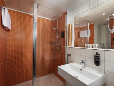 Ein Badezimmer in der Unterkunft ibis Styles Berlin Treptow