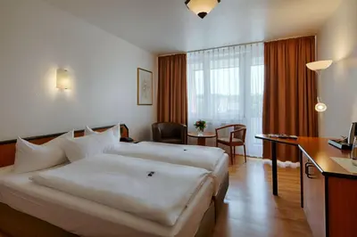 Ein Bett oder Betten in einem Zimmer der Unterkunft Comfort Hotel Bernau