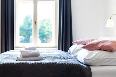 Ein Bett oder Betten in einem Zimmer der Unterkunft Hotel am Hain