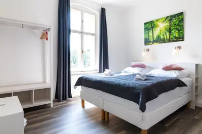 Ein Bett oder Betten in einem Zimmer der Unterkunft Hotel am Hain
