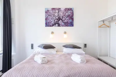 Ein Bett oder Betten in einem Zimmer der Unterkunft Hotel am Hain