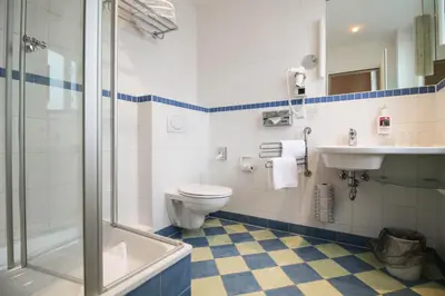 Ein Badezimmer in der Unterkunft Hotel Sachsenhof