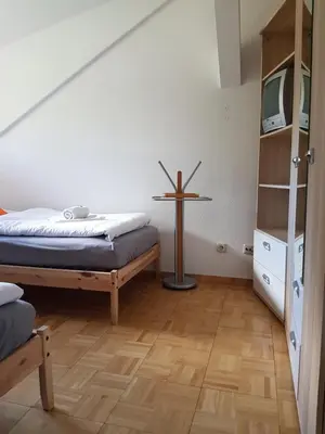 Ein Bett oder Betten in einem Zimmer der Unterkunft Pension Hubertus