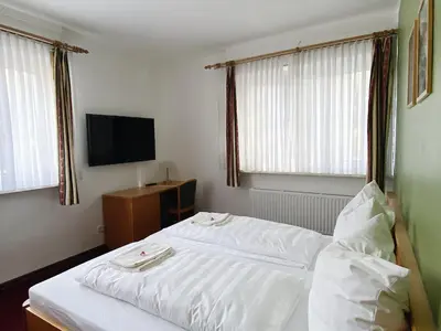 Ein Bett oder Betten in einem Zimmer der Unterkunft Waldrestaurant & Hotel