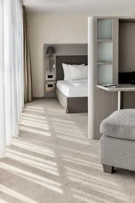 Ein Bett oder Betten in einem Zimmer der Unterkunft The Mandala Berlin, a Member of Design Hotels