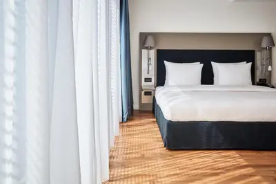 Ein Bett oder Betten in einem Zimmer der Unterkunft The Mandala Berlin, a Member of Design Hotels