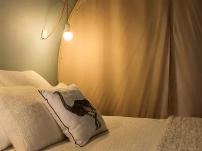 Ein Bett oder Betten in einem Zimmer der Unterkunft Coco Sweet Zelte am Strandbad