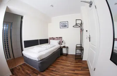 Ein Bett oder Betten in einem Zimmer der Unterkunft Hotel Karlshorst