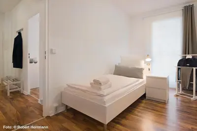 Ein Bett oder Betten in einem Zimmer der Unterkunft Apartments am Brandenburger Tor