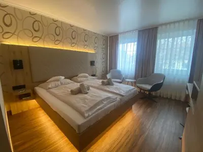 Ein Bett oder Betten in einem Zimmer der Unterkunft Apart Hotel Haveltreff