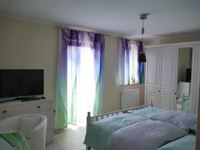 Ein Bett oder Betten in einem Zimmer der Unterkunft Ferienzimmer Weltenbummler,Rheinsberg