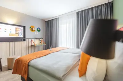 Ein Bett oder Betten in einem Zimmer der Unterkunft Holiday Inn - the niu, Amity Potsdam by IHG