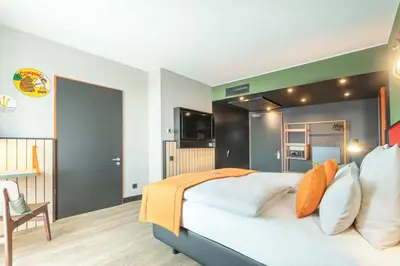 Ein Bett oder Betten in einem Zimmer der Unterkunft Holiday Inn - the niu, Amity Potsdam by IHG