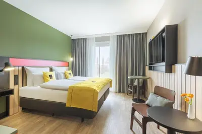 Ein Bett oder Betten in einem Zimmer der Unterkunft Holiday Inn - the niu, Amity Potsdam by IHG