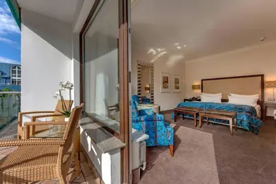 Ein Bett oder Betten in einem Zimmer der Unterkunft Bernstein Hotel Villa Kastania