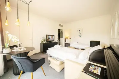 Ein Bett oder Betten in einem Zimmer der Unterkunft Bernstein Hotel Villa Kastania