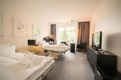 Ein Bett oder Betten in einem Zimmer der Unterkunft Bernstein Hotel Villa Kastania