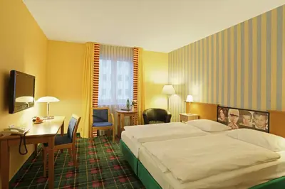 Ein Bett oder Betten in einem Zimmer der Unterkunft Grünau Hotel