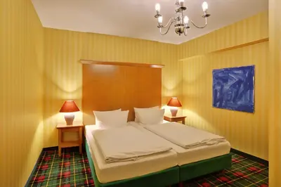 Ein Bett oder Betten in einem Zimmer der Unterkunft Grünau Hotel